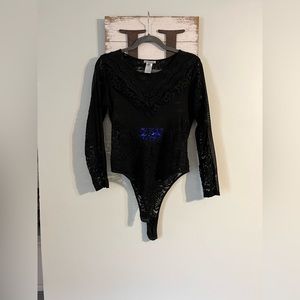 Charlotte Russe sheer black body suit. Size large.